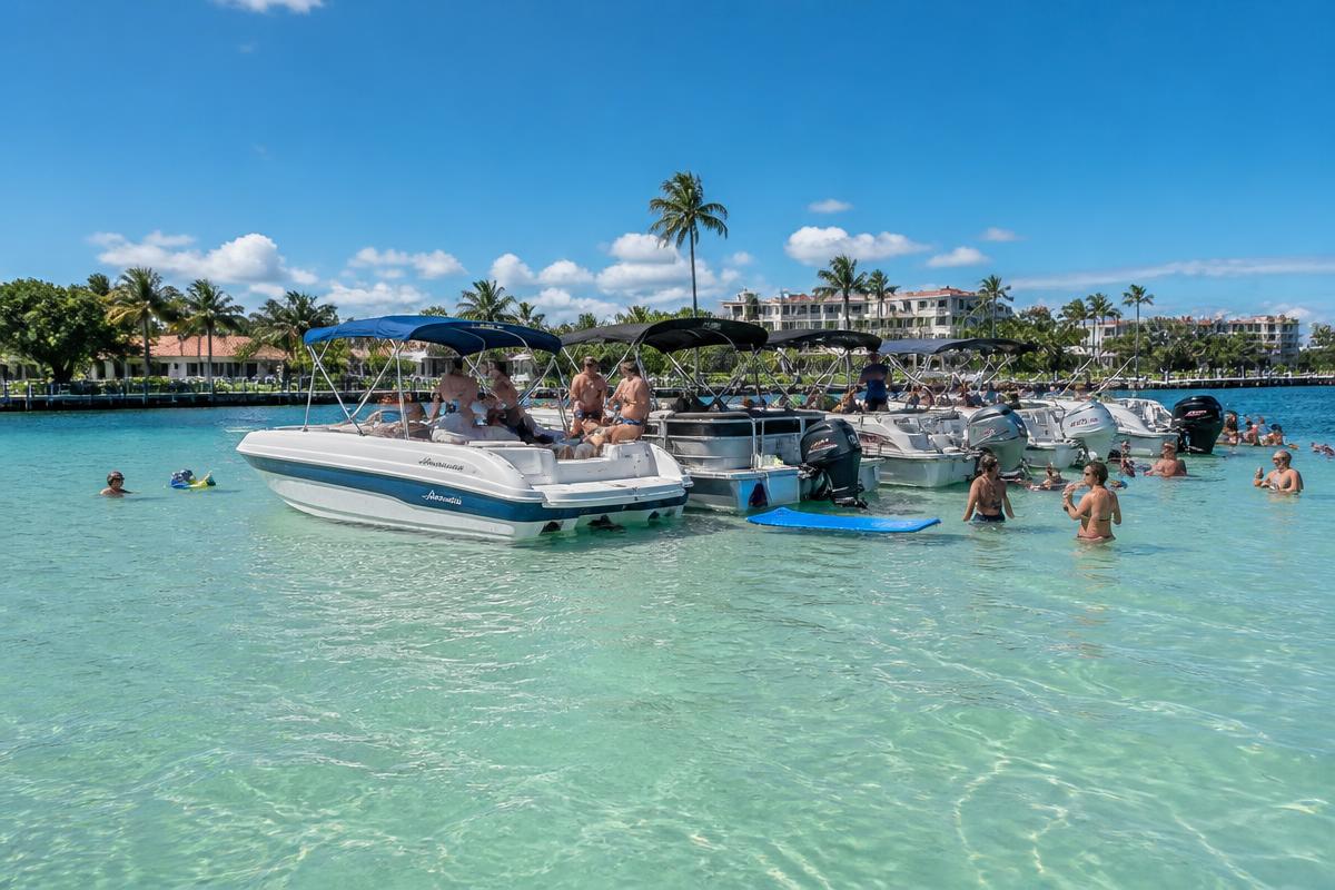 Boats anchored together at the Boca Raton sandbar on a sunny South Florida day